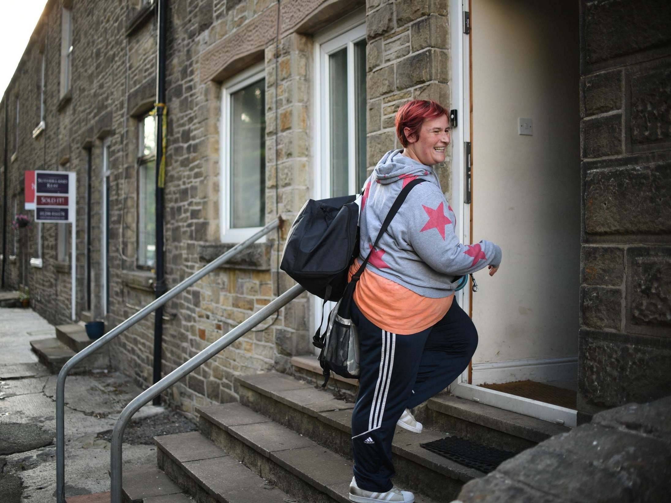 Melissa Broxup returns to her home in the town of Whaley Bridge, Derbyshire, 6 August 2019.