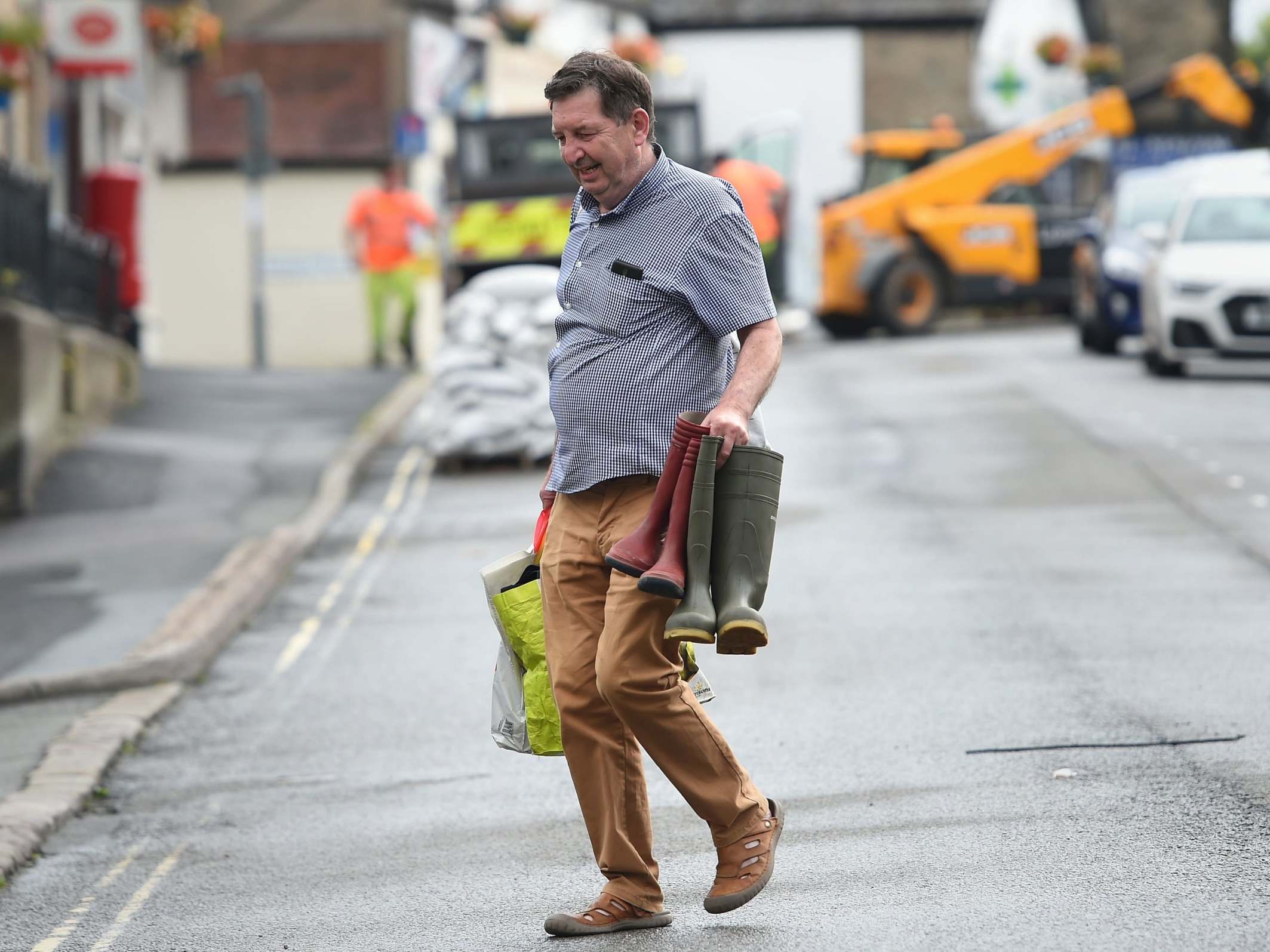 Phil Sharples returns to his house in Whaley Bridge, Derbyshire