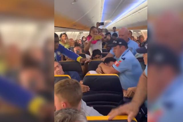Footage shows a British passenger dragged off a Ryanair flight