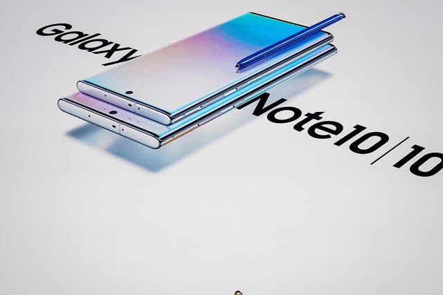 DJ Koh, president and CEO of Samsung Electronics, presents the Galaxy Note 10 smartphone during a launch event at Barclays Center on 7 August, 2019 in New York