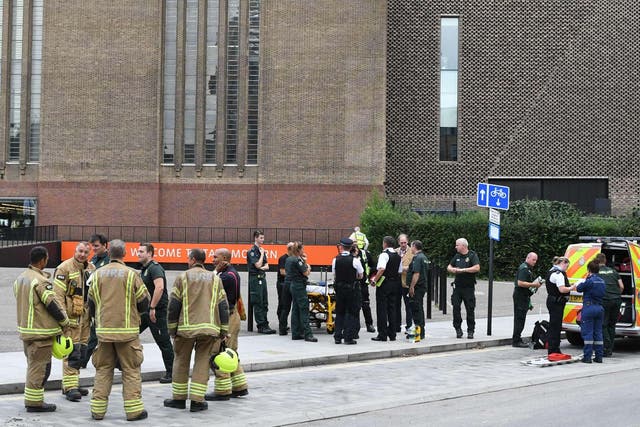&#13;
Emergency services outside Tate Modern after it was evacuated following the incident (AFP/Getty)&#13;