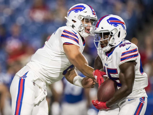 Tyree Jackson hands the ball off to Christian Wade to score a touchdown with his first play in the NFL