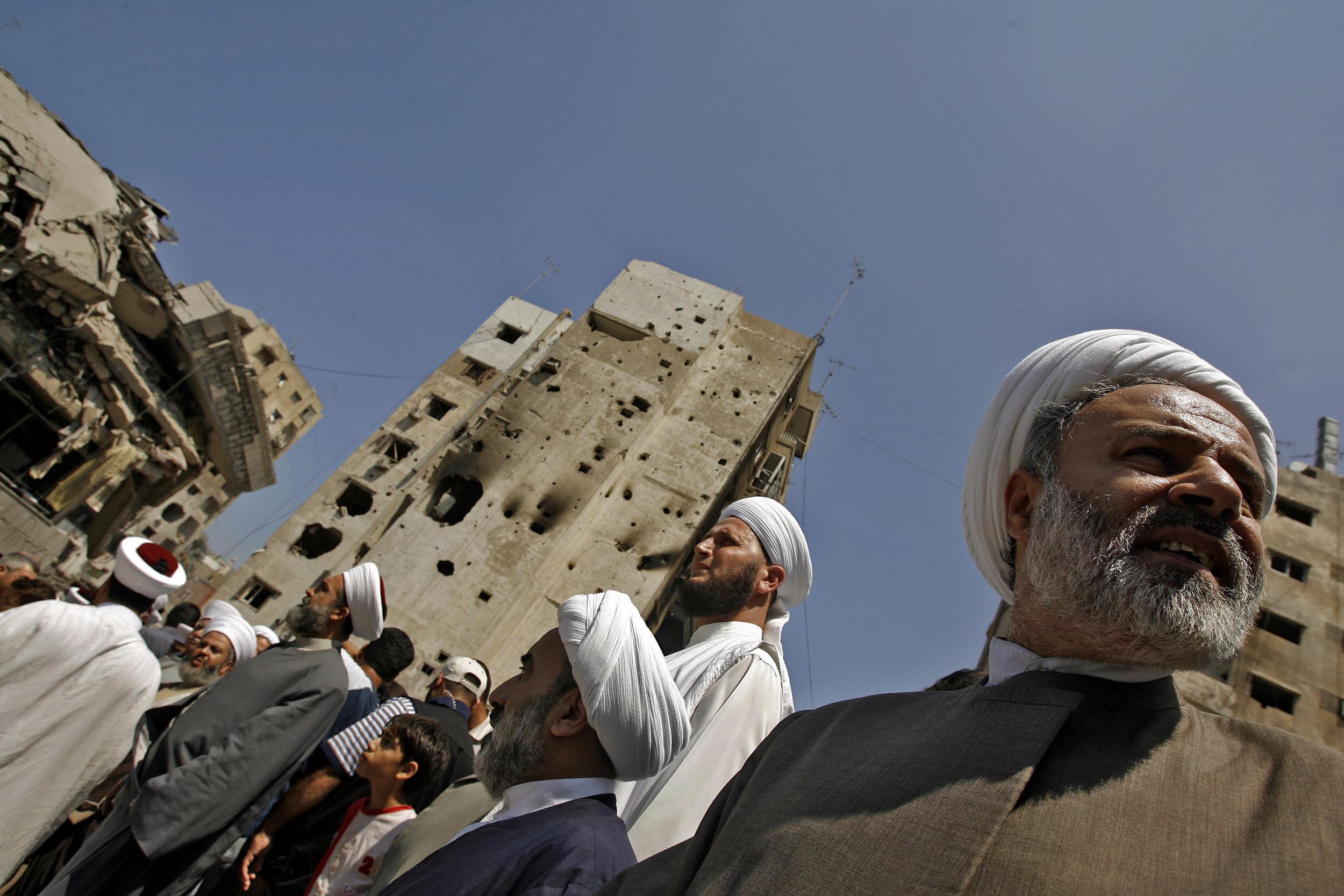 Shia and Sunni Muslim clerics stand on the rubble of Hezbollah’s al-Manar TV station in Beirut. Humanist education helped Lebanon recover from its 15-year war (AFP/Getty)