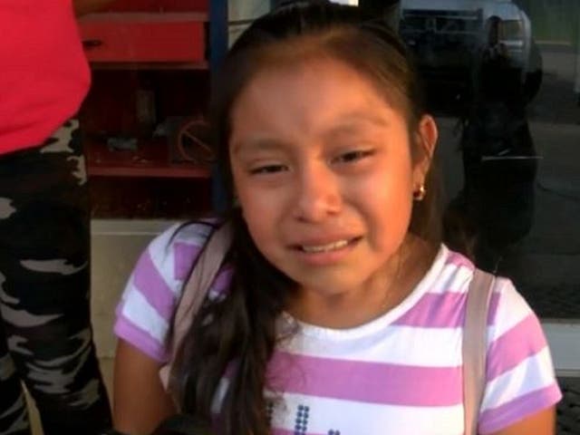 Magdalena Gomez Gregorio, 11, cries as she pleads for her father to be released following migrant raids on food factories in Mississippi, US.