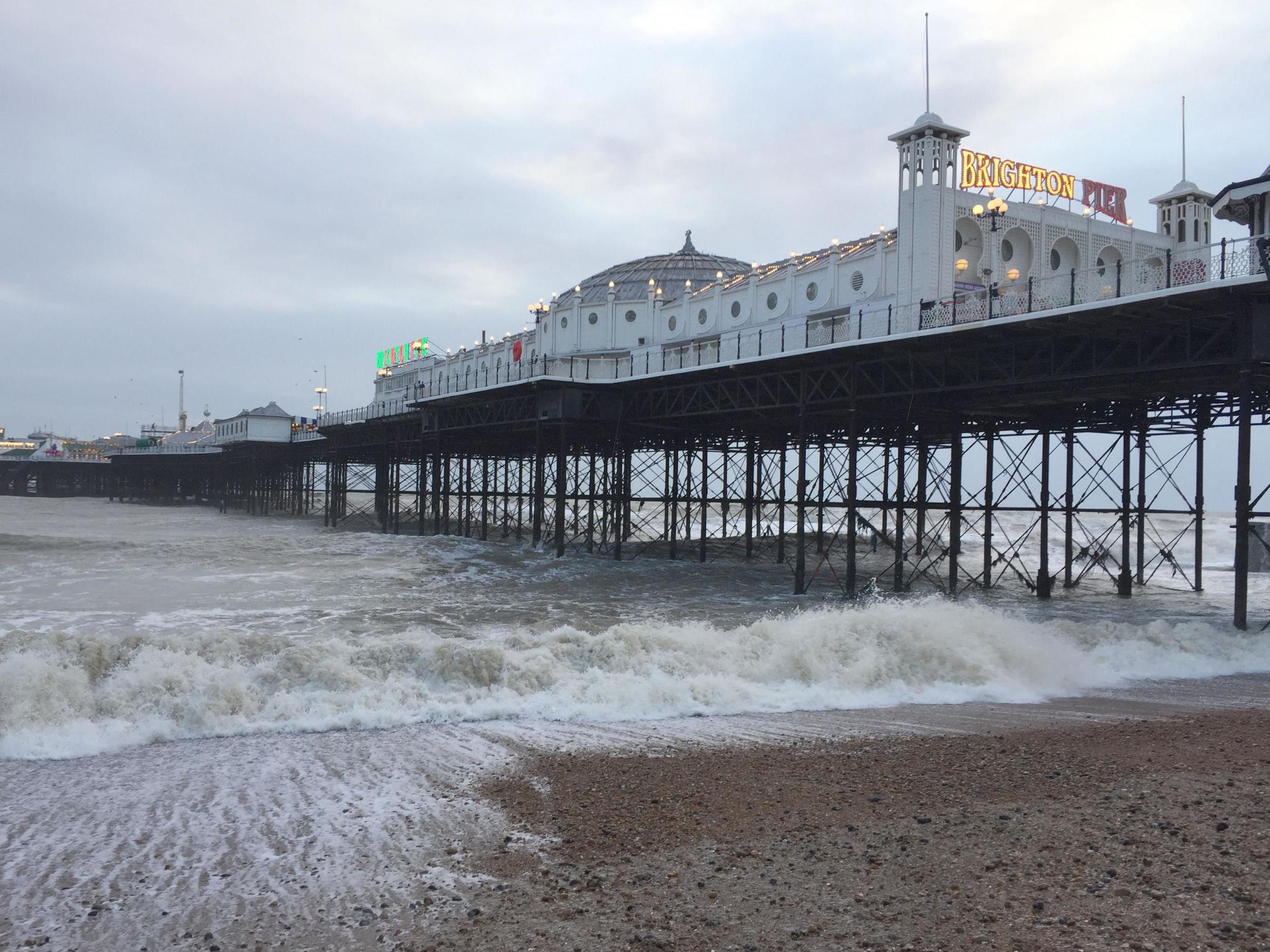 A child was found beneath Brighton Pier by volunteers as violent storms battered the country