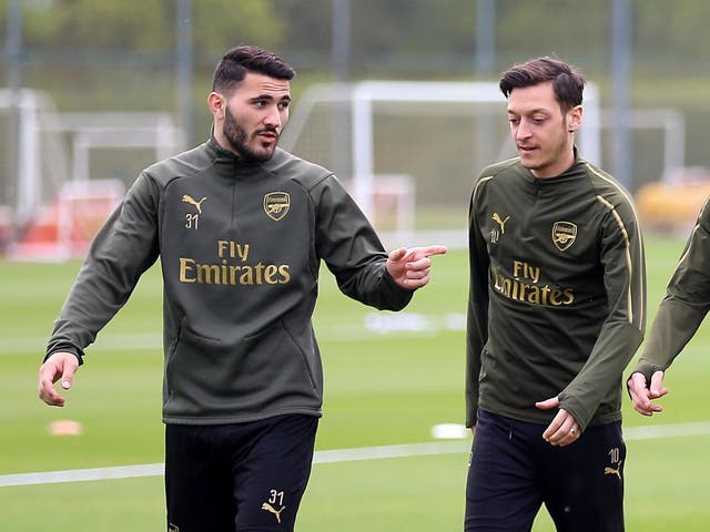 File photo dated 01/05/19 of Arsenal's Sead Kolasinac (left) and Mesut Ozil