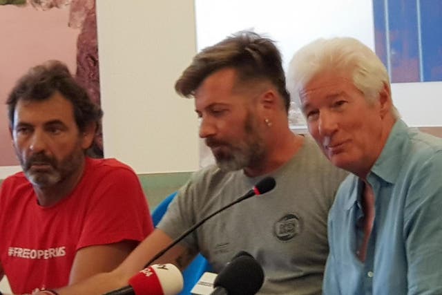Richard Gere speaks during a press conference on the island of Lampedusa on 10 August 2019, a day after he visited the Spanish humanitarian ship that has been stuck at sea with 121 migrants on board for over a week, after Italy and Malta have denied it entry.