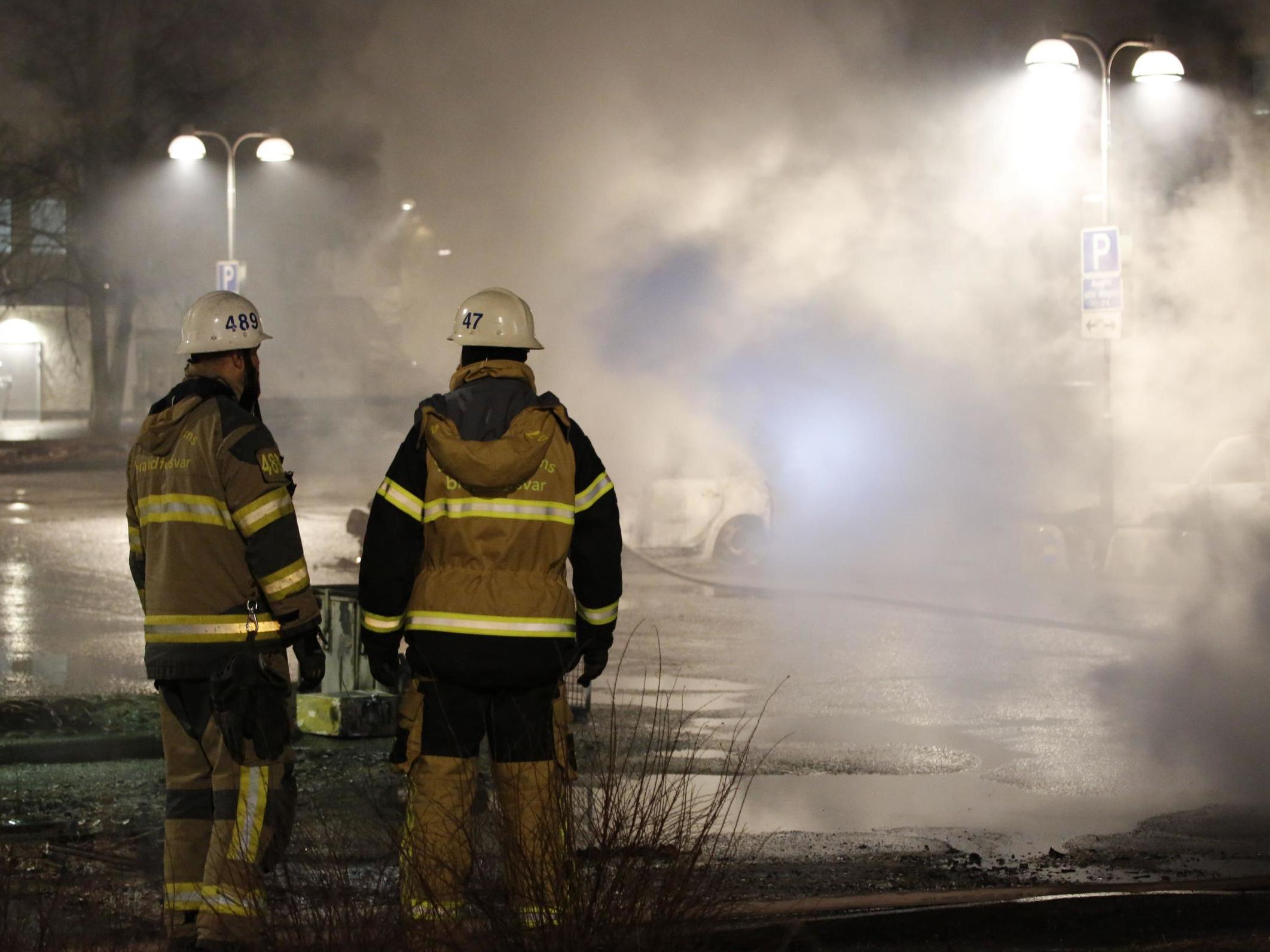 Several cars were set alight in Rinkeby two days after Trump referenced an incident of refugee violence in the district that never actually happened (AFP/Getty)