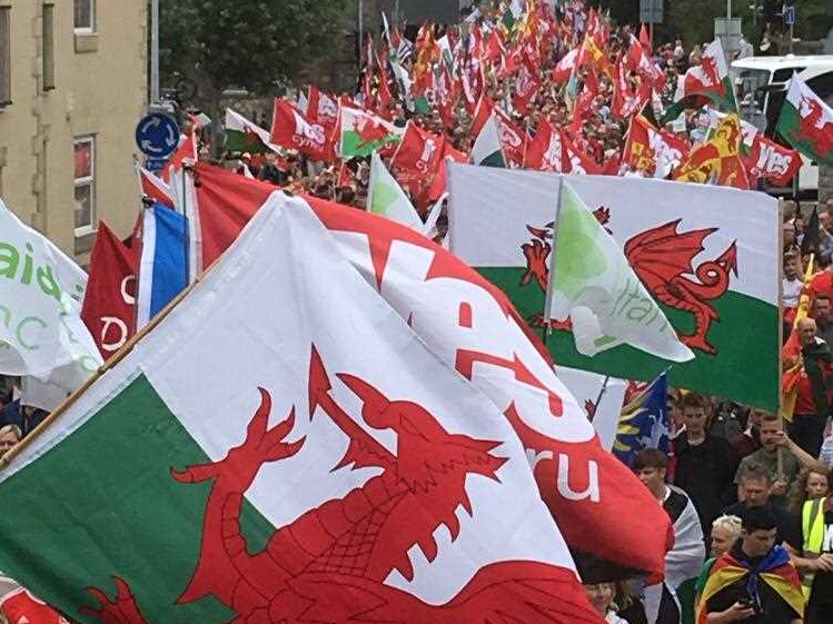 Huge Welsh flags are waved at the rally