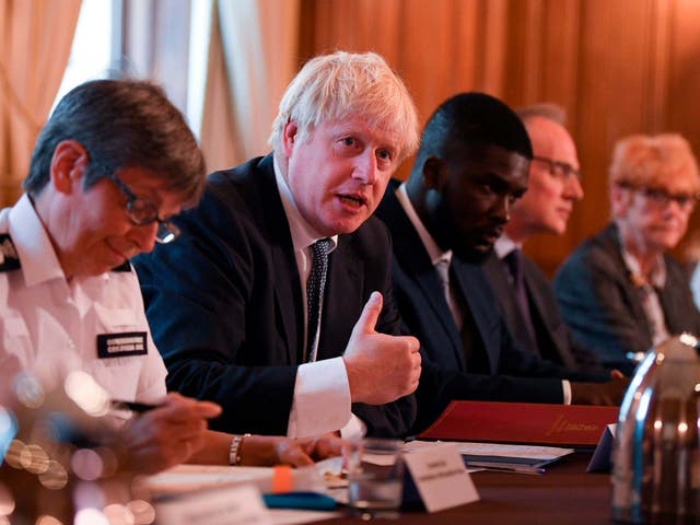 Boris Johnson is flanked by Cressida Dick (left, Metropolitan Police commissioner) and Roy Sefa-Attakora (Youth Justice Board adviser) during a roundtable on the criminal justice system at 10 Downing Street