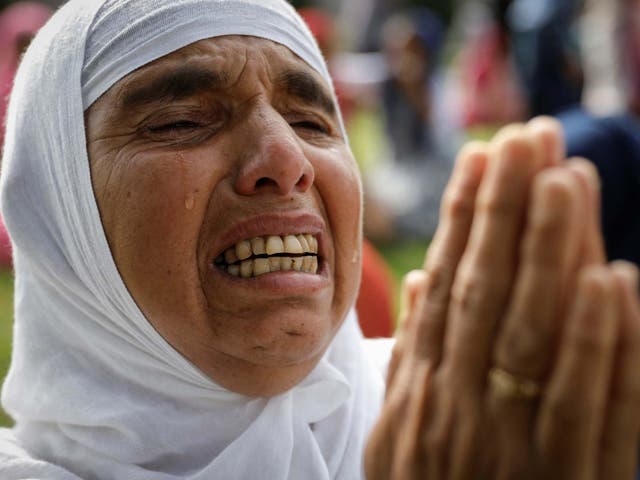A Kashmiri woman cries during Eid prayers at a mosque in Srinagar