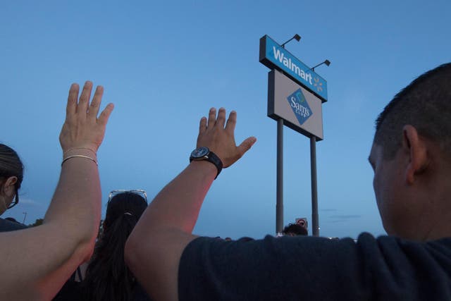 Many gathered to pray at the makeshift memorial for 22 victims of a far-right inspired mass shooting in Walmart's El Paso store