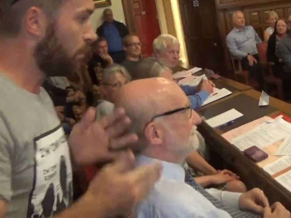 Liberal Democrat peer calls protester in Tommy Robinson shirt a 'Nazi' over mosque row