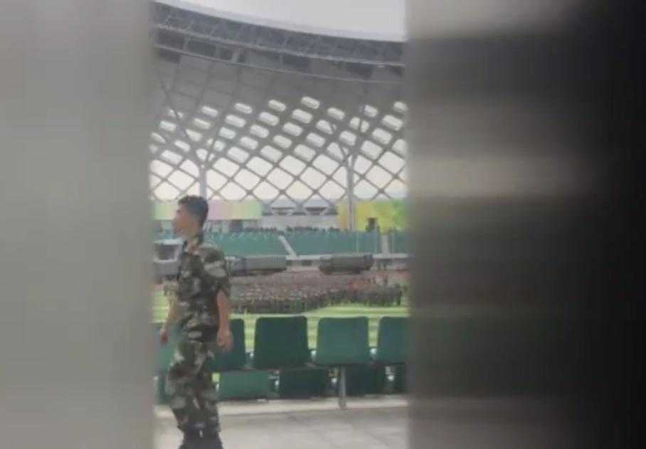 Footage published by the AFP news agency appears to show Chinese forces marching in a stadium near the Hong Kong border