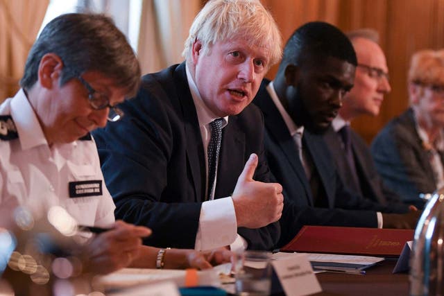 Boris Johnson in Downing Street, London, with Metropolitan Police Commissioner Cressida Dick (left) and Youth Justice Board Advisor Roy Sefa-Attakora (3rd right),  during a roundtable on crime on 12 August