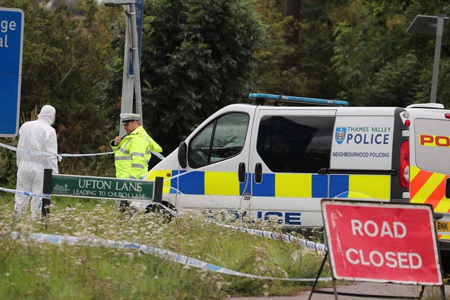 Police officers at the scene on Ufton Lane, near Sulhamstead, Berkshire, on Friday