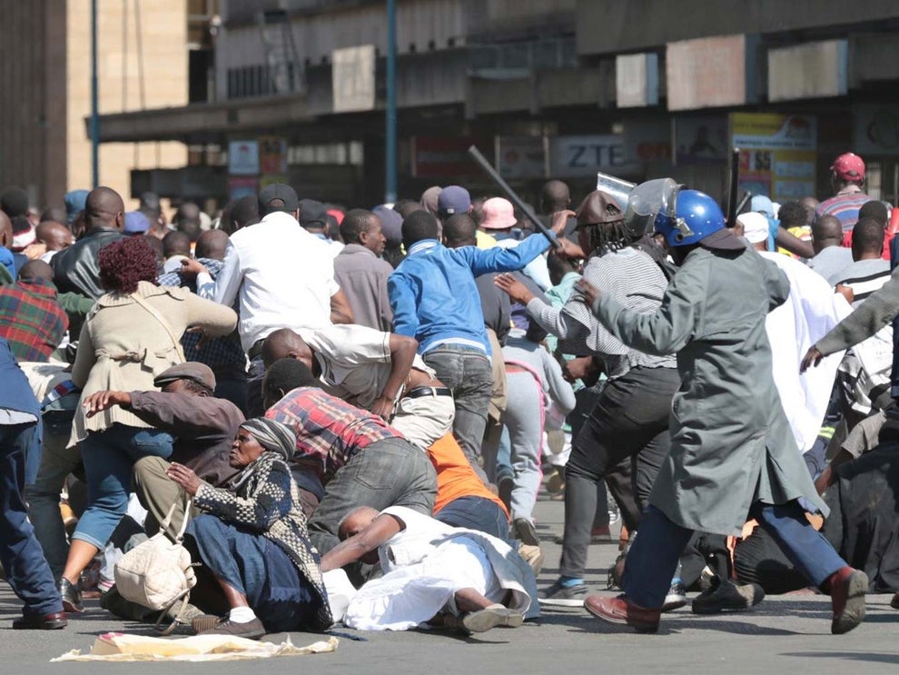 Zimbabwes police beat anti-government protesters in capital