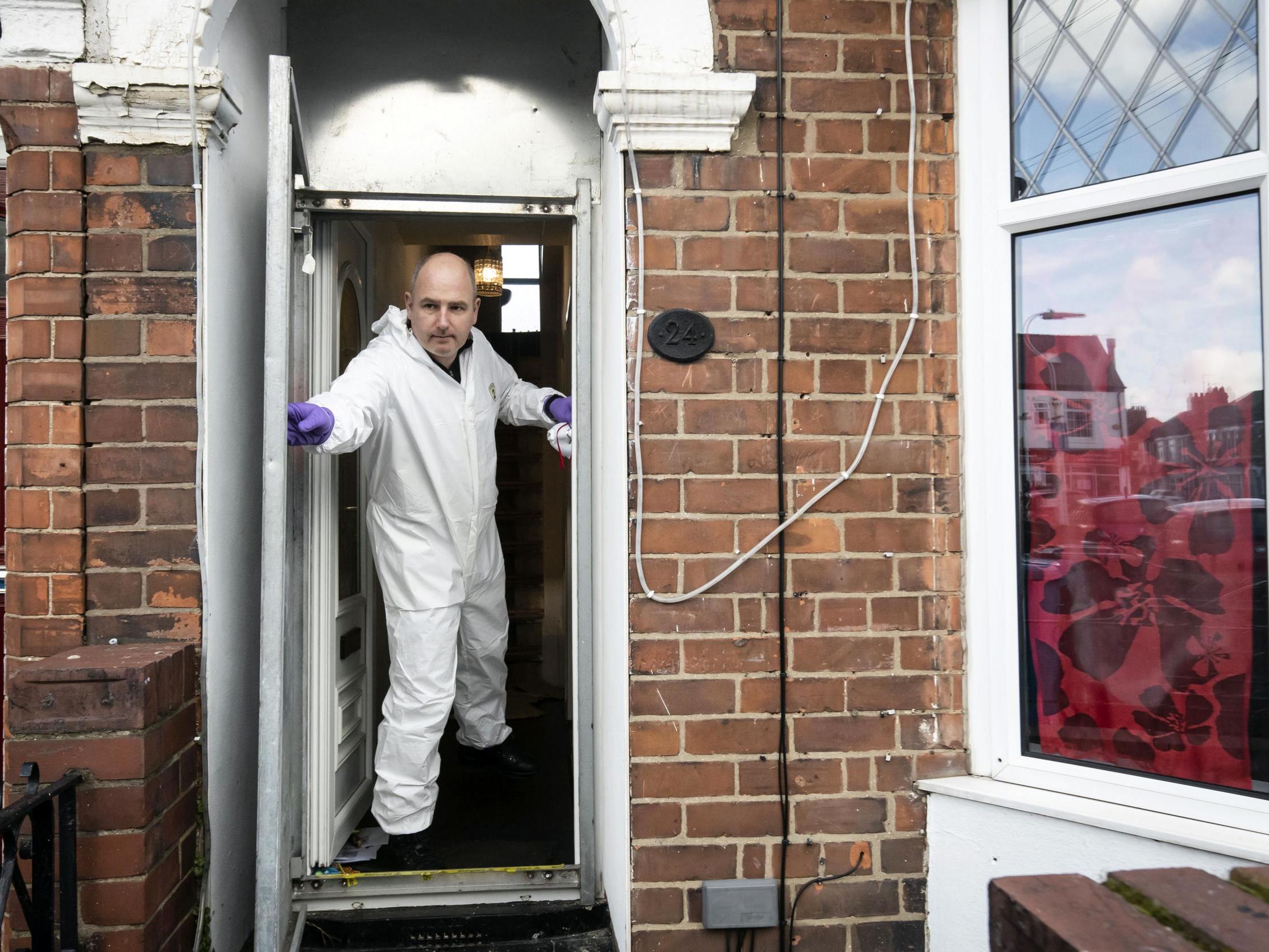 A police officer at Pawel Relowicz's home in Hull (PA)