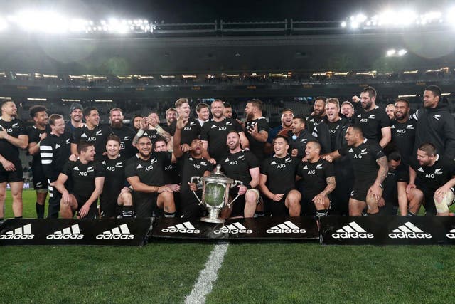 The All Blacks celebrate with the Bledisloe Cup