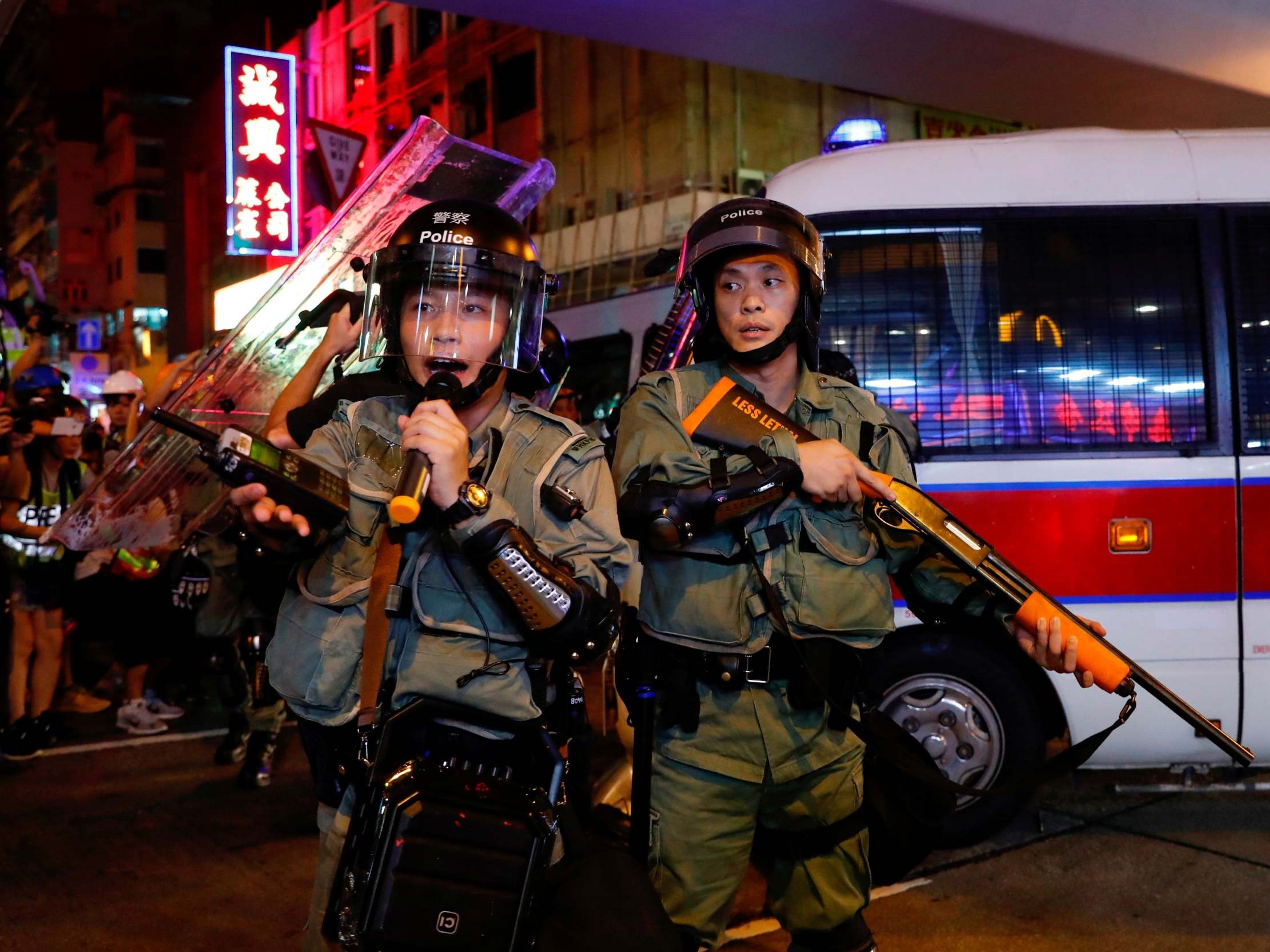 Riot police stand guard after an anti-extradition bill march at Mongkok, in Hong Kong, on 17 August