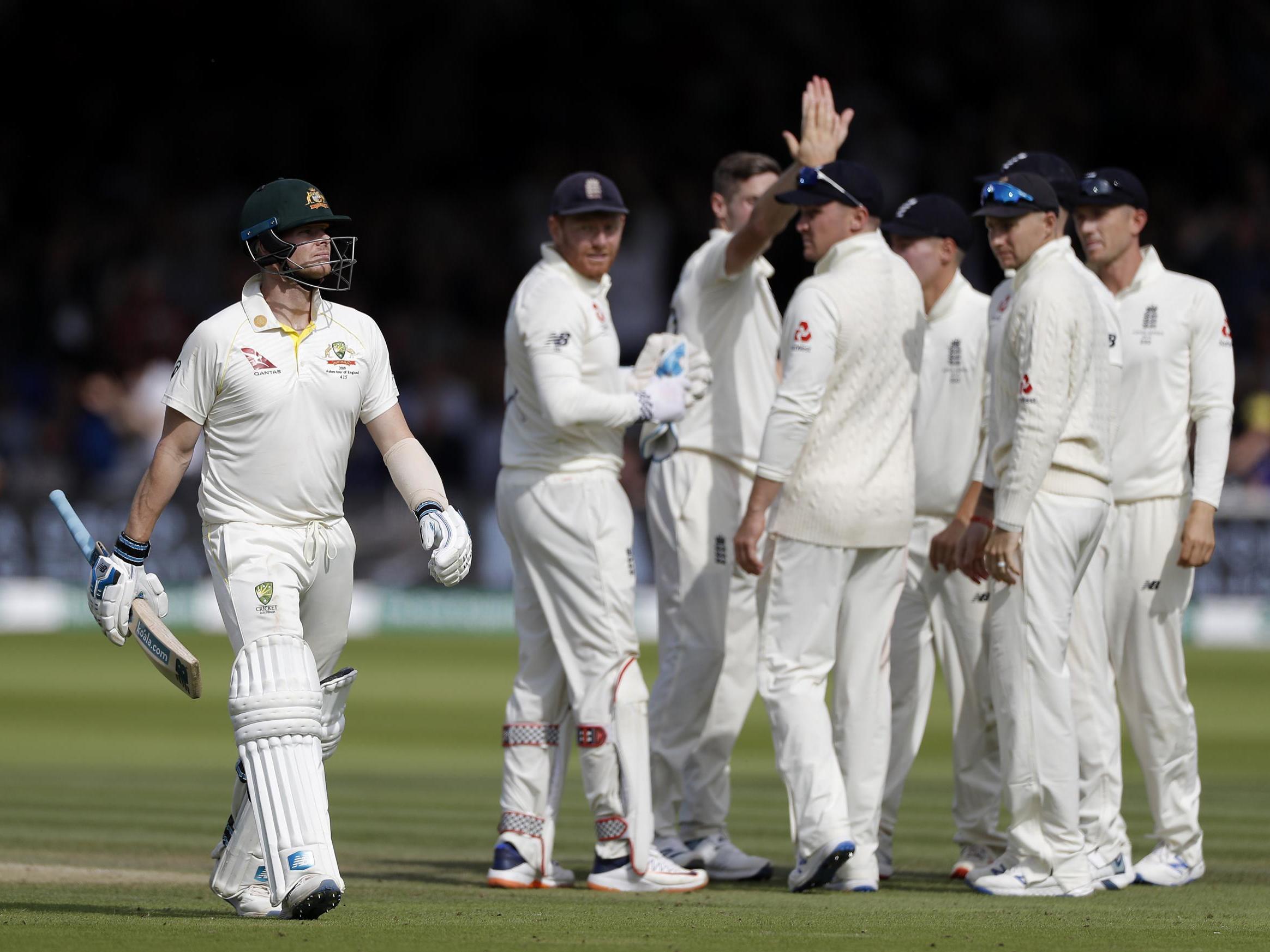 Chris Woakes celebrates after dismissing Steve Smith for 92