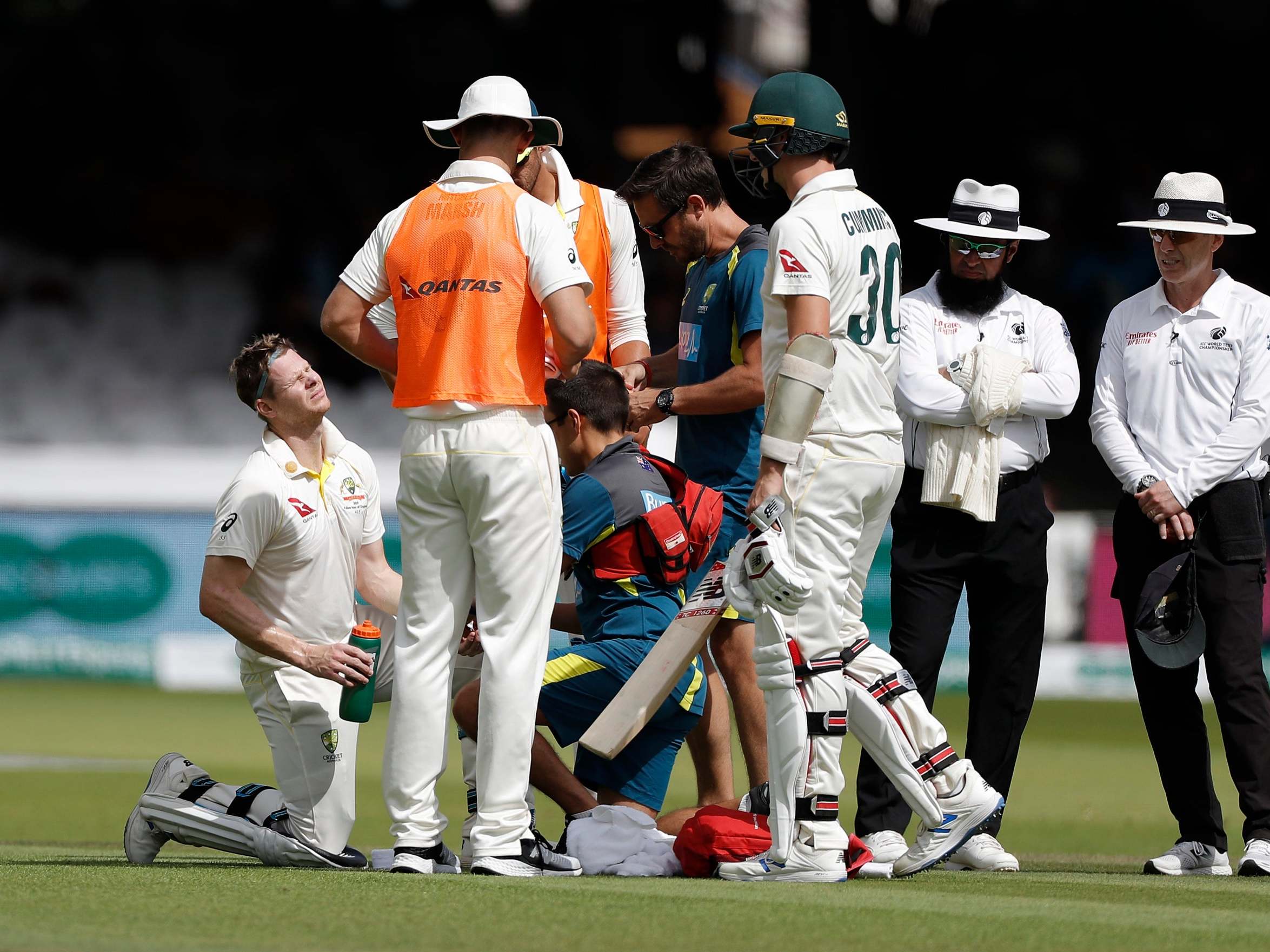 Steve Smith is treated after being struck on the arm