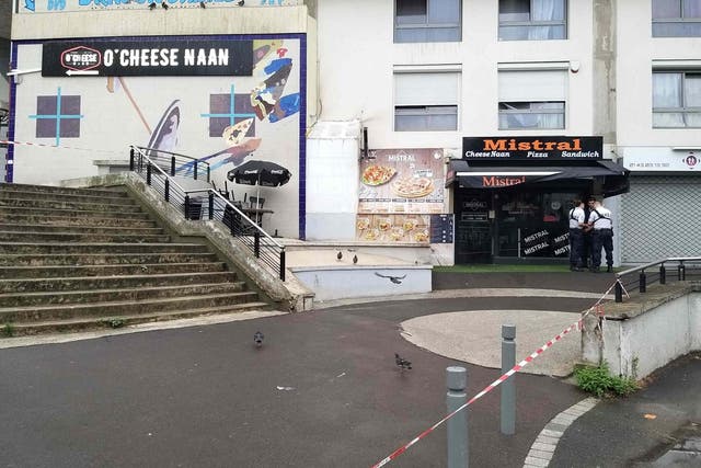 Police stand in front of the Mistral cafe in the eastern Paris suburb of Noisy-le-Grand