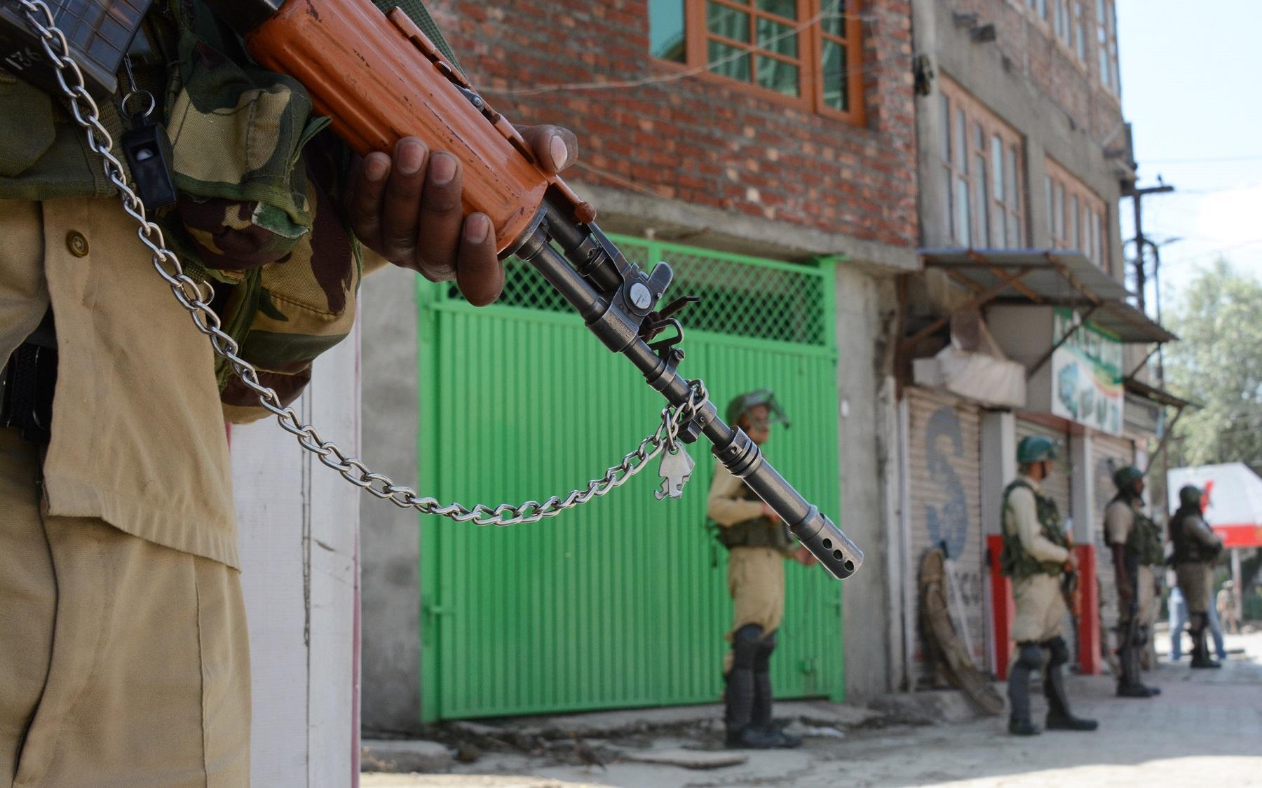 Soldiers stand guard in Srinigar, Kashmir, as India’s crackdown continues