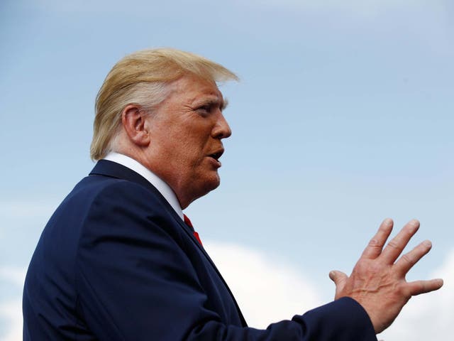 President Donald Trump speaks with reporters before boarding Air Force One at Morristown Municipal Airport in Morristown, New Jersey