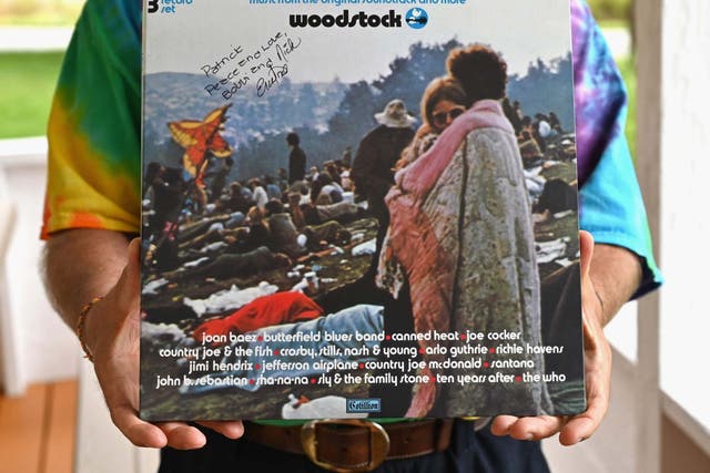 A live album of "Woodstock: Music from the Original Soundtrack and More" features couple Bobbi and Nick Ercoline on the cover