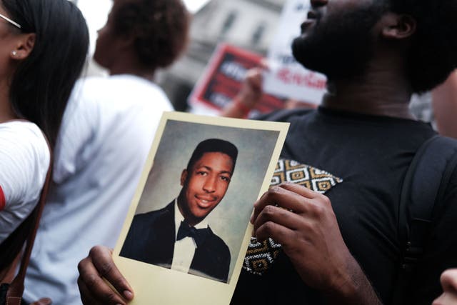 Protesters mark the five year anniversary of the death of Eric Garner, who repeated the phrase "I can't breathe" almost a dozen times while being arrested for an alleged misdemeanor
