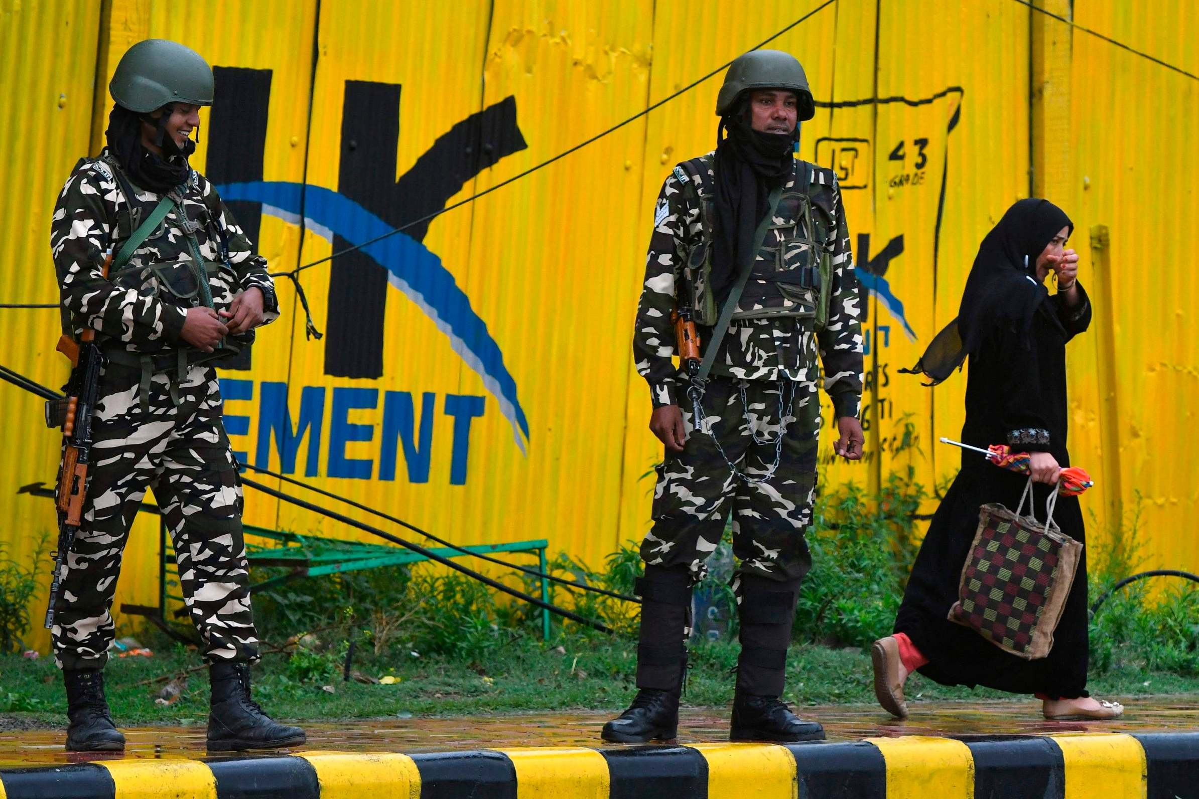 Security forces stand guard near a closed school in Srinagar (AFP/Getty)