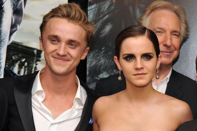 Tom Felton and  Emma Watson attend the New York premiere of "Harry Potter And The Deathly Hallows: Part 2" at Avery Fisher Hall, Lincoln Center on July 11, 2011 in New York City.
