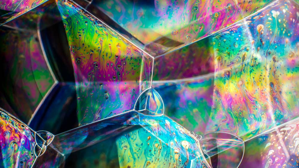 Soap bubble structures showing light interference colours and patterning