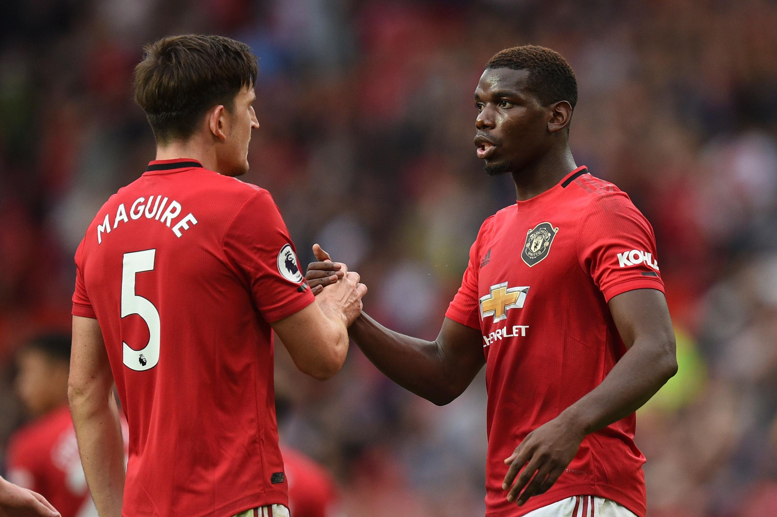 Harry Maguire and Paul Pogba playing for Manchester United