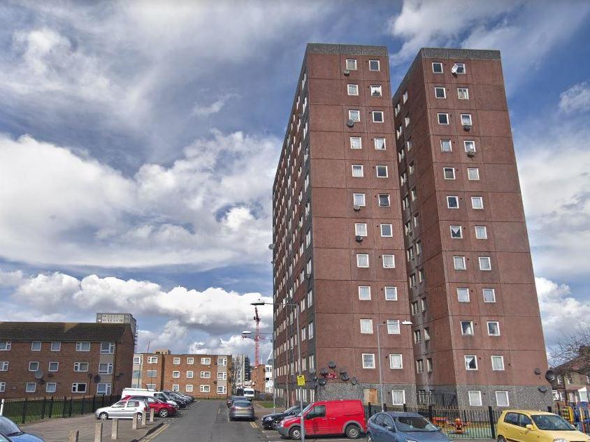 Police have evacuated Earlsdown House in Barking after a man barricaded himself in a seventh-floor flat and threatened to set it alight