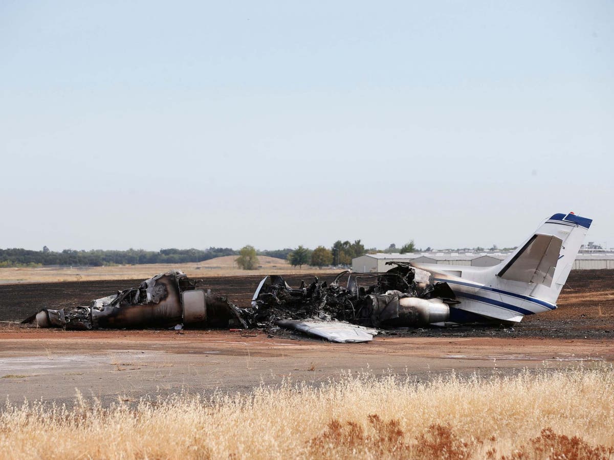 Plane bursts into flames after aborted take-off at California airport