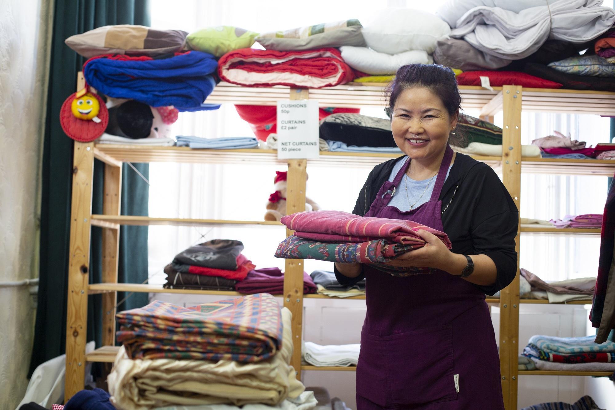 A volunteer in the clothes stores at Asylum Link Merseyside