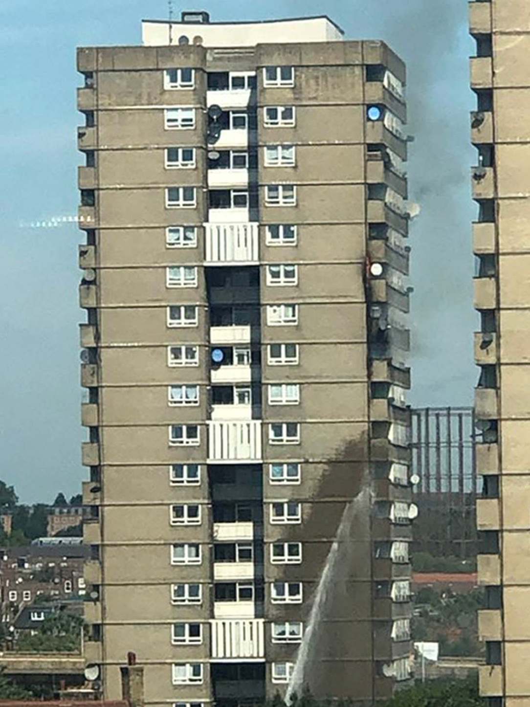 Firefighters put out the balcony fire in Markland House, Notting Hill