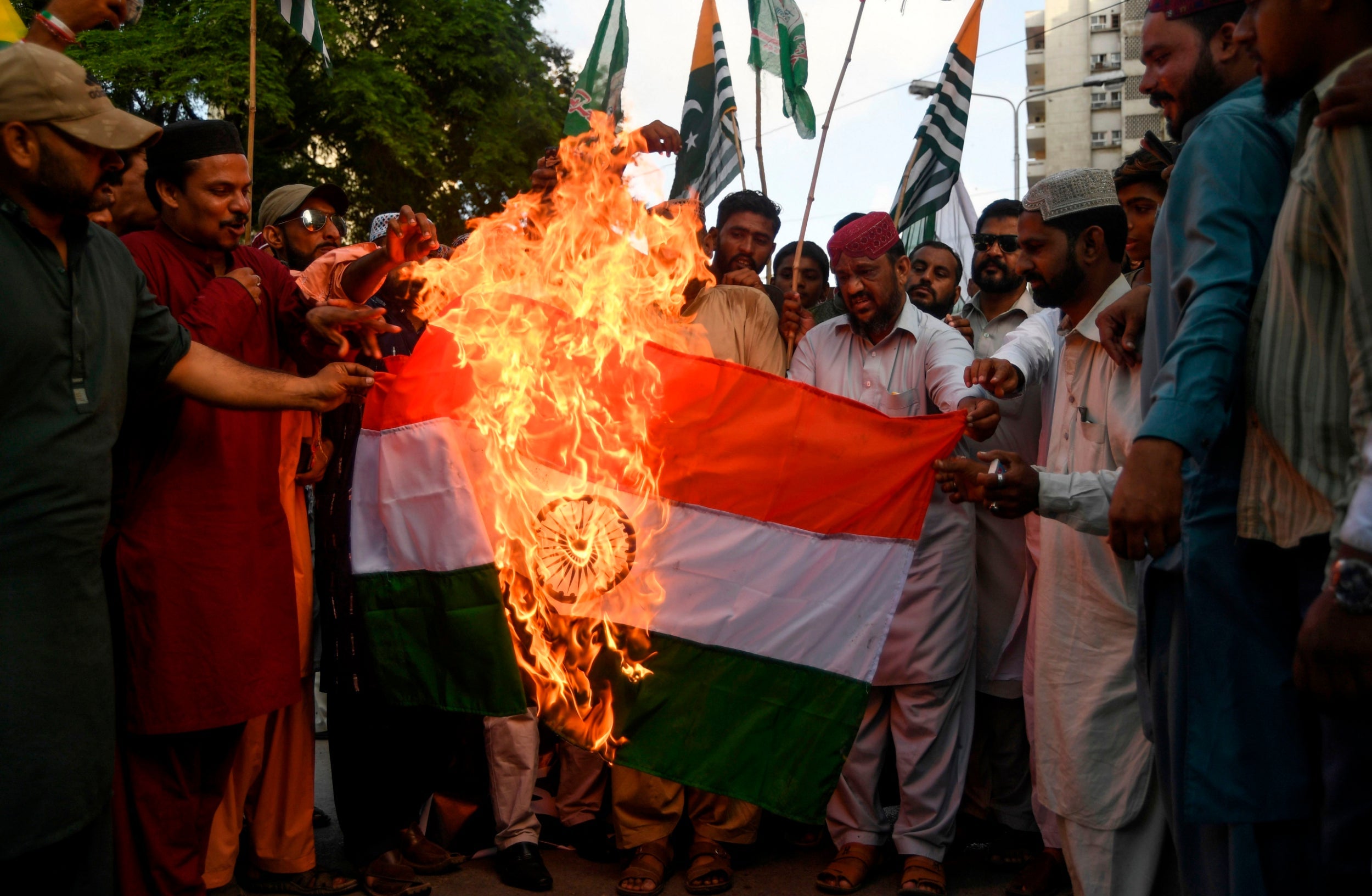 Demonstrators burn an Indian flag during a protest in Karachi