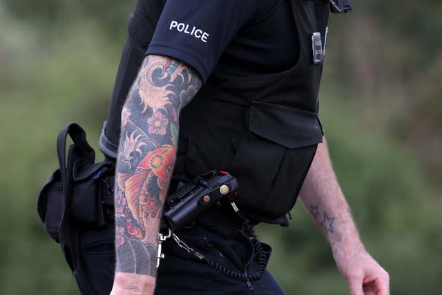 Officers for West Yorkshire Police were allowed to show 'small and inoffensive' tattoos on their neck and hands but not on their arms
