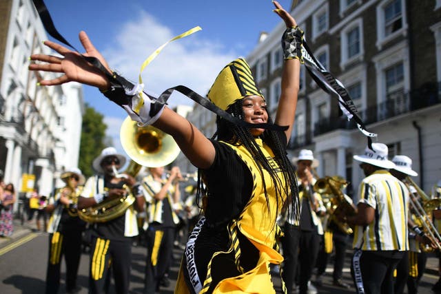 Dancers perform during the Children's Day parade at the Notting Hill Carnival in west London