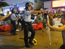 Hong Kong police filmed pointing guns at protesters 
