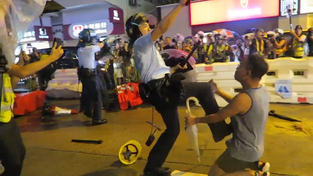 Footage posted on a number of social media sites appears to show police kicking an unarmed civilian
