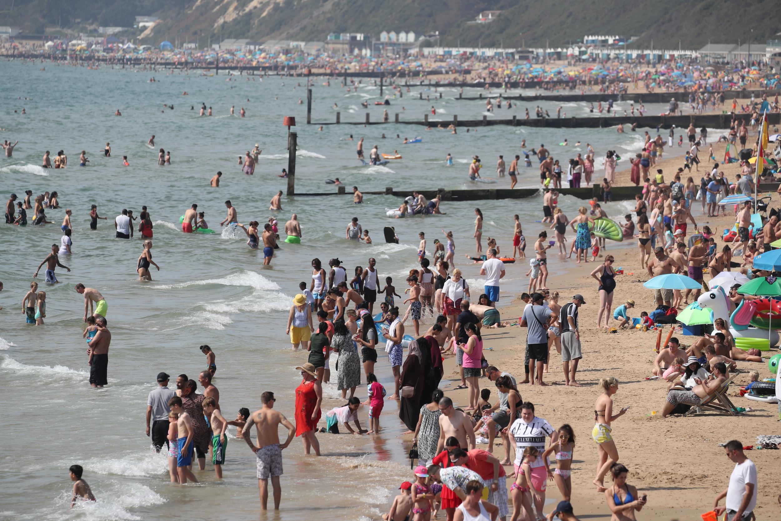 People enjoying the warm weather on Bournemouth beach during the August bank holiday