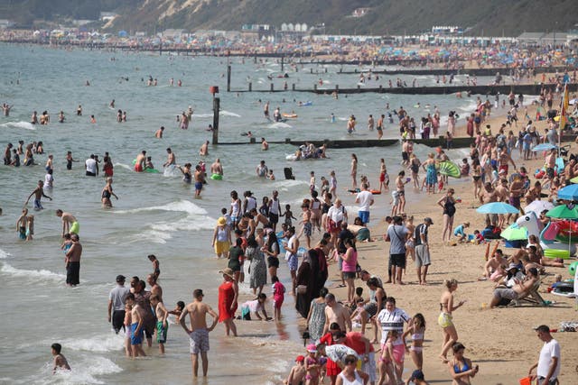 People enjoying the warm weather on Bournemouth beach during the August bank holiday