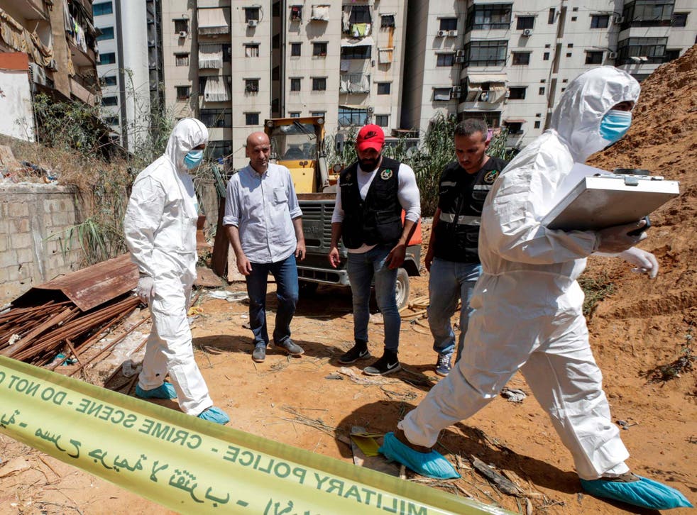 Forensic investigators of Lebanon's military intelligence inspecting the scene where two drones came down in the vicinity of a media centre of the Shiite Hezbollah movement on Saturday.