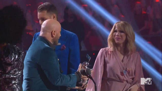 John Travolta tries to hand the award for Best Music Video to Taylor Swift