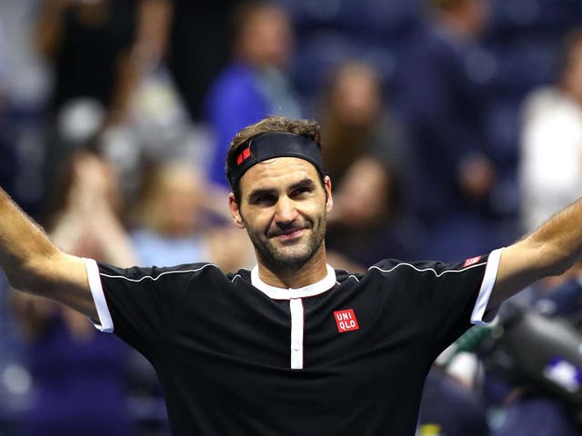 Roger Federer applauds the US Open crowd after victory