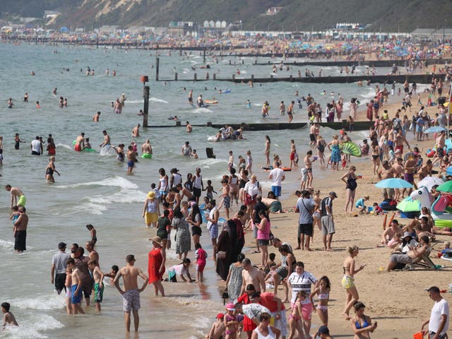 People enjoy the warm weather on Bournemouth beach during the late August bank holiday, 24 August 2019.
